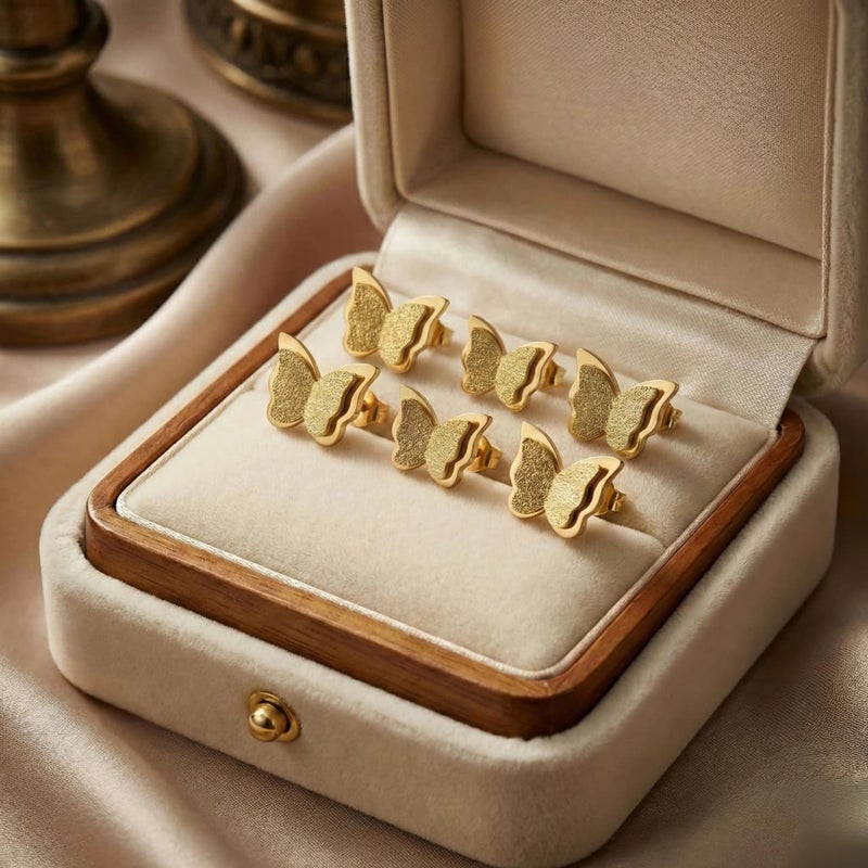 A set of 3 pairs of gold butterflies with a double design, made of rust-resistant stainless steel, with graduated sizes to give you layered styling or to choose the perfect size. - Image 4